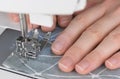 Seaming on the sewing machine Royalty Free Stock Photo